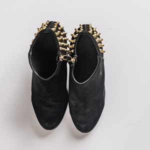 Heeled booties with studs.